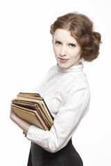 Vintage lady holding ancient books in beautiful hands