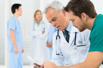 Doctors Discussing In Meeting