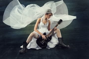 Bride playing rock guitar, wedding funny music