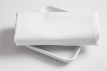 Fototapeta premium dish and tablecloth on white clothe table
