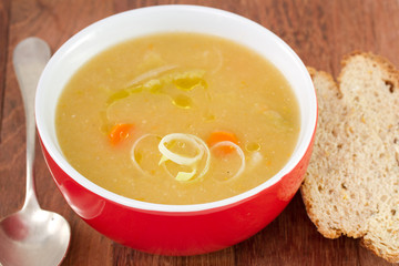 vegetable soup in red bowl