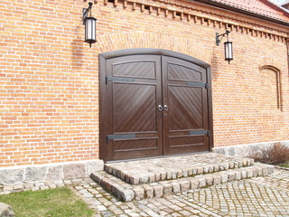 Brick facade with wooden gate