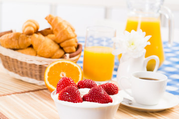 early breakfast, juice, croissants and Berries