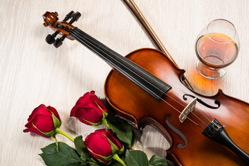 Fototapeta premium Violin, rose, glass of champagne and music books