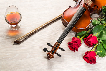 Fototapeta premium Violin, rose, glass of champagne and music books