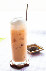 A glass of cold thai milk tea