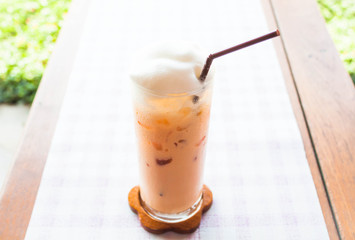 Fresh glass of cold thai milk tea