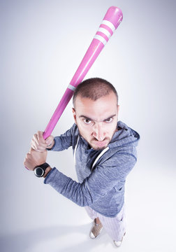 Funny Hooligan With A Pink Baseball Bat Looking Angry