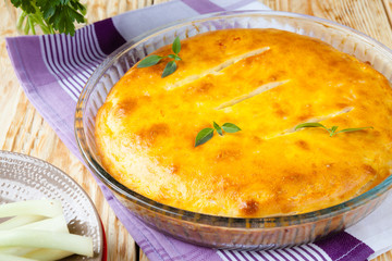 closed pie with onions with a golden crust