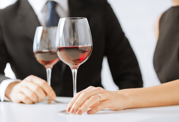 engaged couple with wine glasses