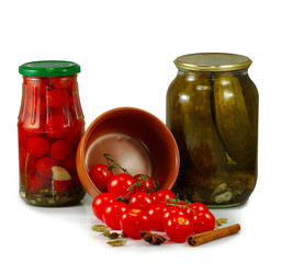 jars with tomatoes and cucumbers
