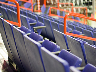 Naklejka premium Blue Folding Seats at an Indoor Sports Arena