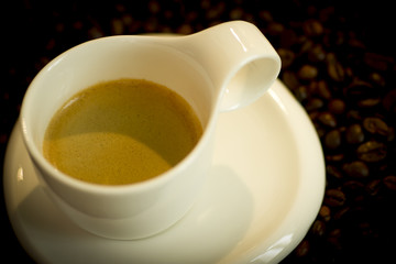 Cup of coffee and coffee beans