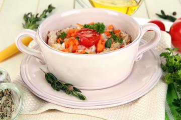Delicious rice with vegetables and herbs in pot