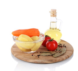Peeled vegetables in bowl isolated on white