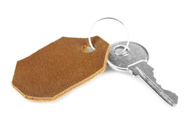 Key with leather trinket isolated on white