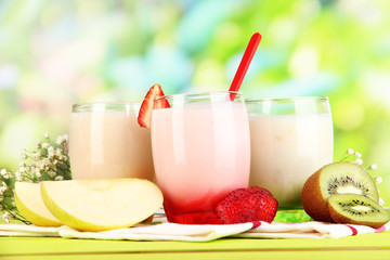 Delicious yogurts with fruits in glasses