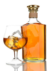 Naklejka na ściany i meble Glass of brandy and bottle isolated on white