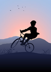 Obraz premium Silhouette illustration of a boy riding a bicycle with mountain