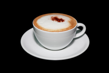white cup of cappuccino coffee in black background