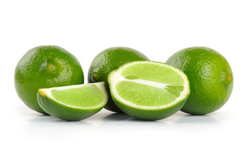 Limes whole and slices. Isolated on white