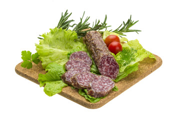 Salami with rosemary, salad and tomatoes