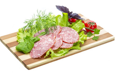 Sausages with salad and basil