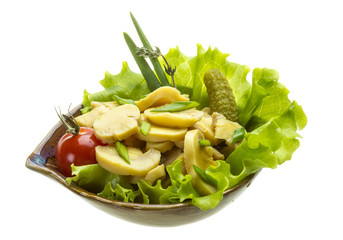 Marinated mushrooms in white saucer isolated on white