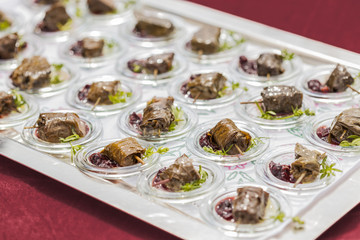 dolmades / stuffed vineleaves with deer and red chutney