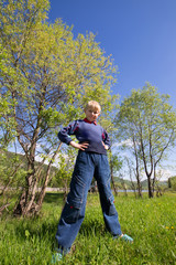 boy stands on the grass