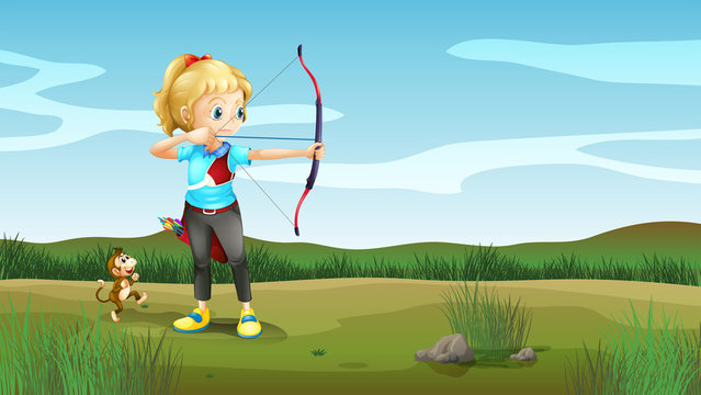 A girl holding an archery with a monkey at the back