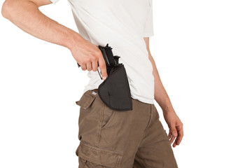 Close-up of a man with holster and a gun