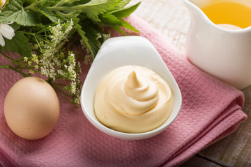 Mayonnaise in bowl on table