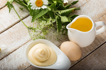 Mayonnaise in bowl on table