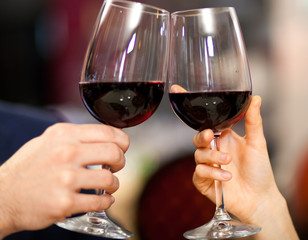 Couple toasting wine glasses