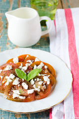 Fresh salad from the black tomatoes and cheese
