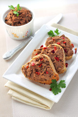 Liver pate with paprika on slices of wholegrain bread