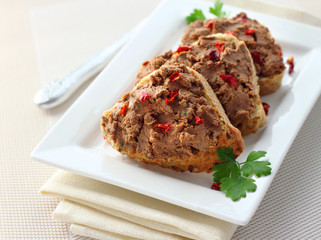 Liver pate with paprika on slices of wholegrain bread