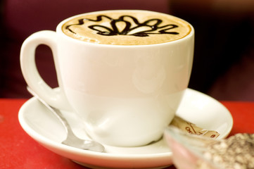 Beautiful decorated cup of coffee with chocolate