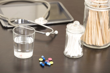 Doctor workplace with digital tablet and stethoscope