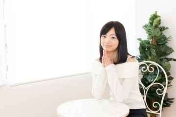 young asian woman relaxing in the cafe