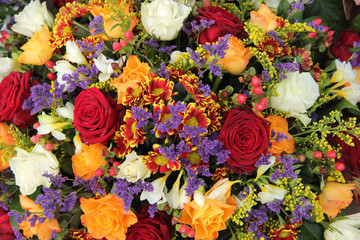 Mixed floral arrangement in yellow, red and white