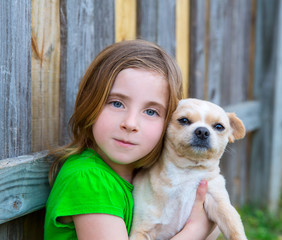 Blond happy girl with her chihuahua doggy portrait