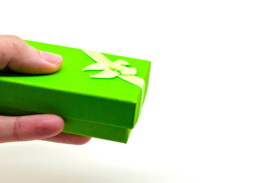 hand holding a green gift box