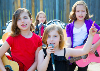 chidren singer girl singing playing live band in backyard