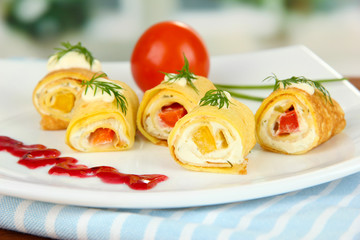 Egg rolls with cheese cream and paprika,on plate,