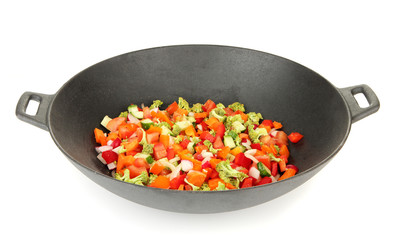 Vegetable ragout in wok, isolated on white