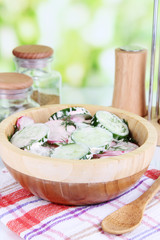 Vitamin vegetable salad in wooden bowl
