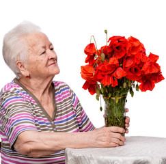 Old woman with bunch of poppies