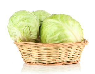 Fototapeta premium Green cabbage in wicker basket, isolated on white
